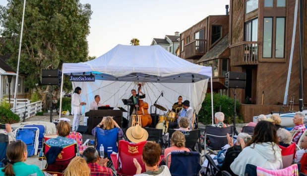 Jazz Salon's owner, David Ross, purchased rubber mat flooring and a cargo parachute to build an outdoor stage for one of their Jazz shows at Alamitos Bay, in Long Beach, Calif.(Photo provided by Jazz Salon)