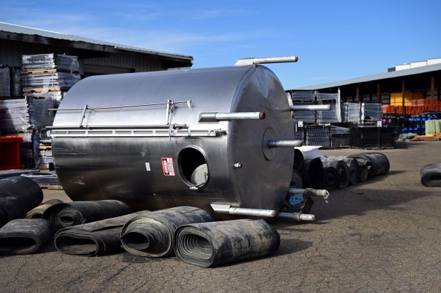 A retired tank and industrial materials at Repurposed Materials in Lafayette, Colorado on Thursday, Nov. 21, 2024. Damon Carson has a business that repurposes discarded materials from all sorts of industries. (Photo by Hyoung Chang/The Denver Post)